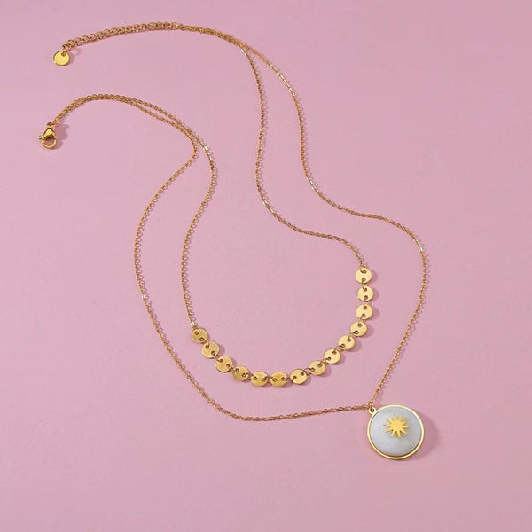 Collier en acier inoxydable duo sertis de pierres de nacres blanches.