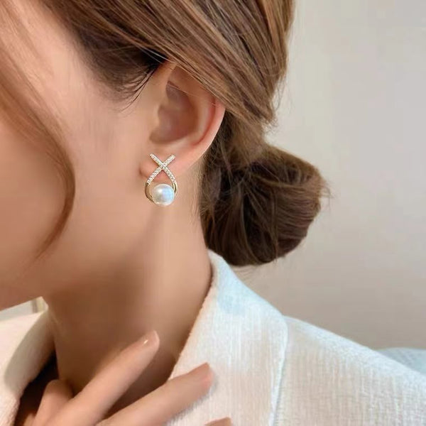 Boucle d'oreille perle d'eau douce X