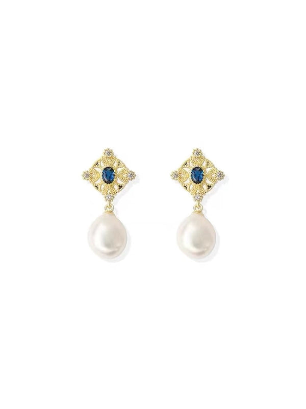Boucle d'oreille perle baroque zircon bleu roi.