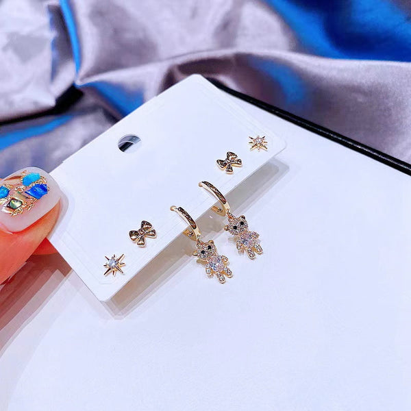 Lot de 6 boucles d'oreilles en forme d'ours en zircon avec nœud étoile.