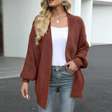 Cardigan caramel à manches lanternes.