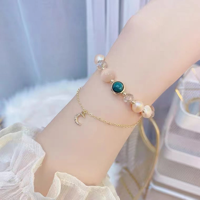 Bracelet réglable en perles d'eau douce et oeil de chat