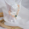 Bracelet réglable en perles d'eau douce et oeil de chat