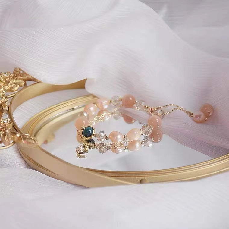 Bracelet réglable en perles d'eau douce et oeil de chat