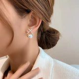 Boucle d'oreille perle d'eau douce X