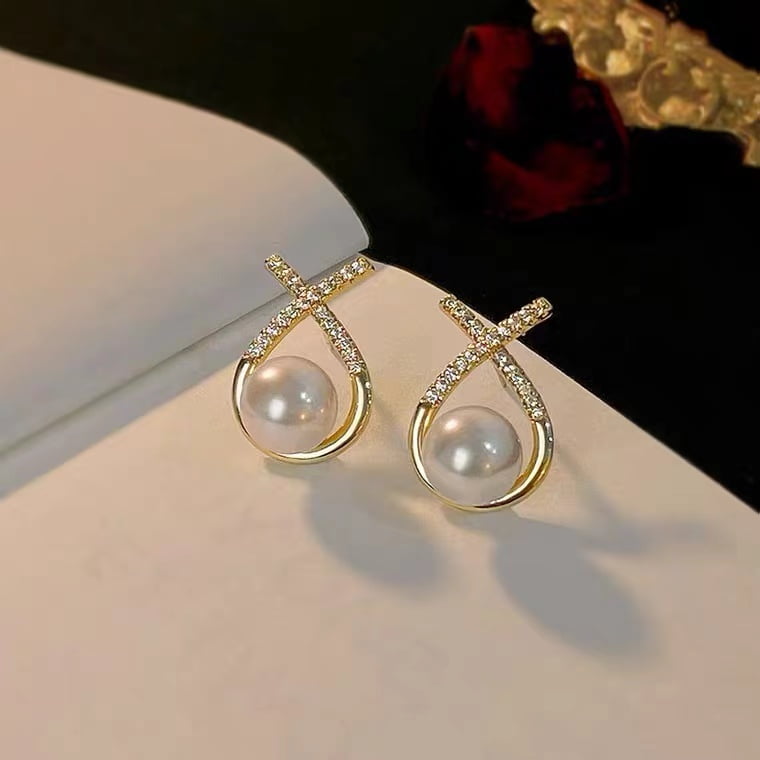 Boucle d'oreille perle d'eau douce X