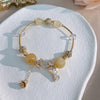 Bracelet marguerite en quartz rutilé doré et cristal tchèque
