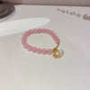 Bracelet papillon en perles d'eau douce et quartz rose