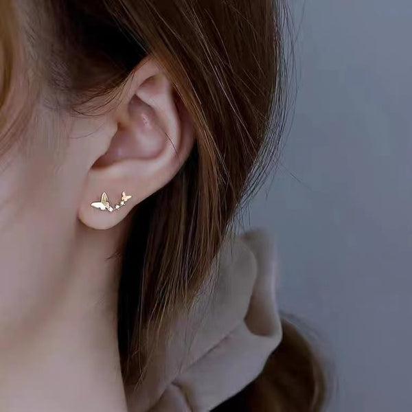 Clous d'oreilles papillon dansant en argent 