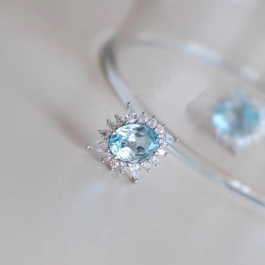 Boucles d'oreilles en argent 925 et topaze bleu ciel pâle
