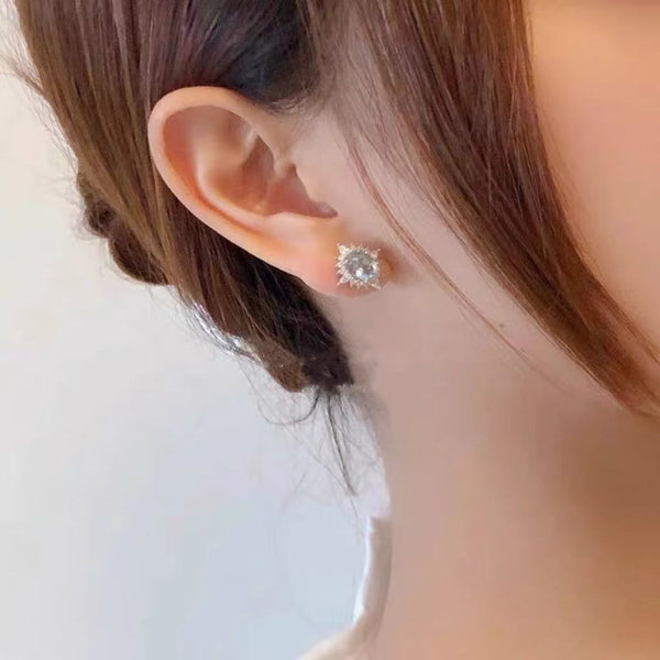 Boucles d'oreilles en argent 925 et topaze bleu ciel pâle