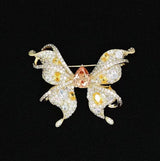 Broche papillon en zircon champagne