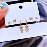 Lot de 6 boucles d'oreilles en forme d'ours en zircon avec nœud étoile.