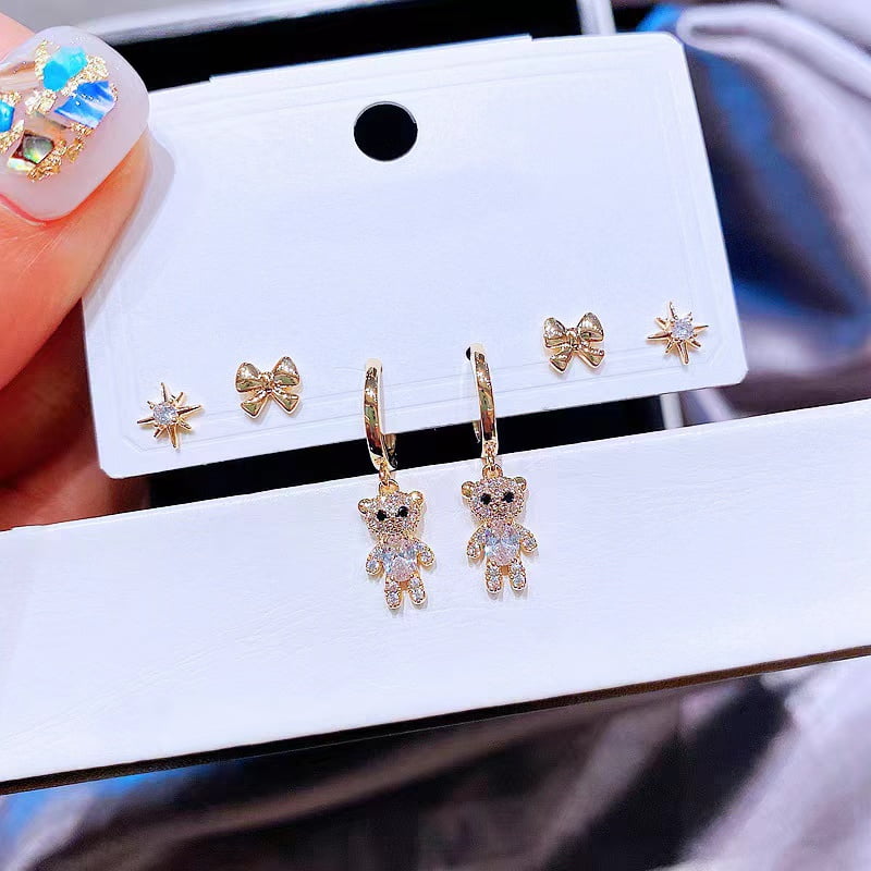 Lot de 6 boucles d'oreilles en forme d'ours en zircon avec nœud étoile.